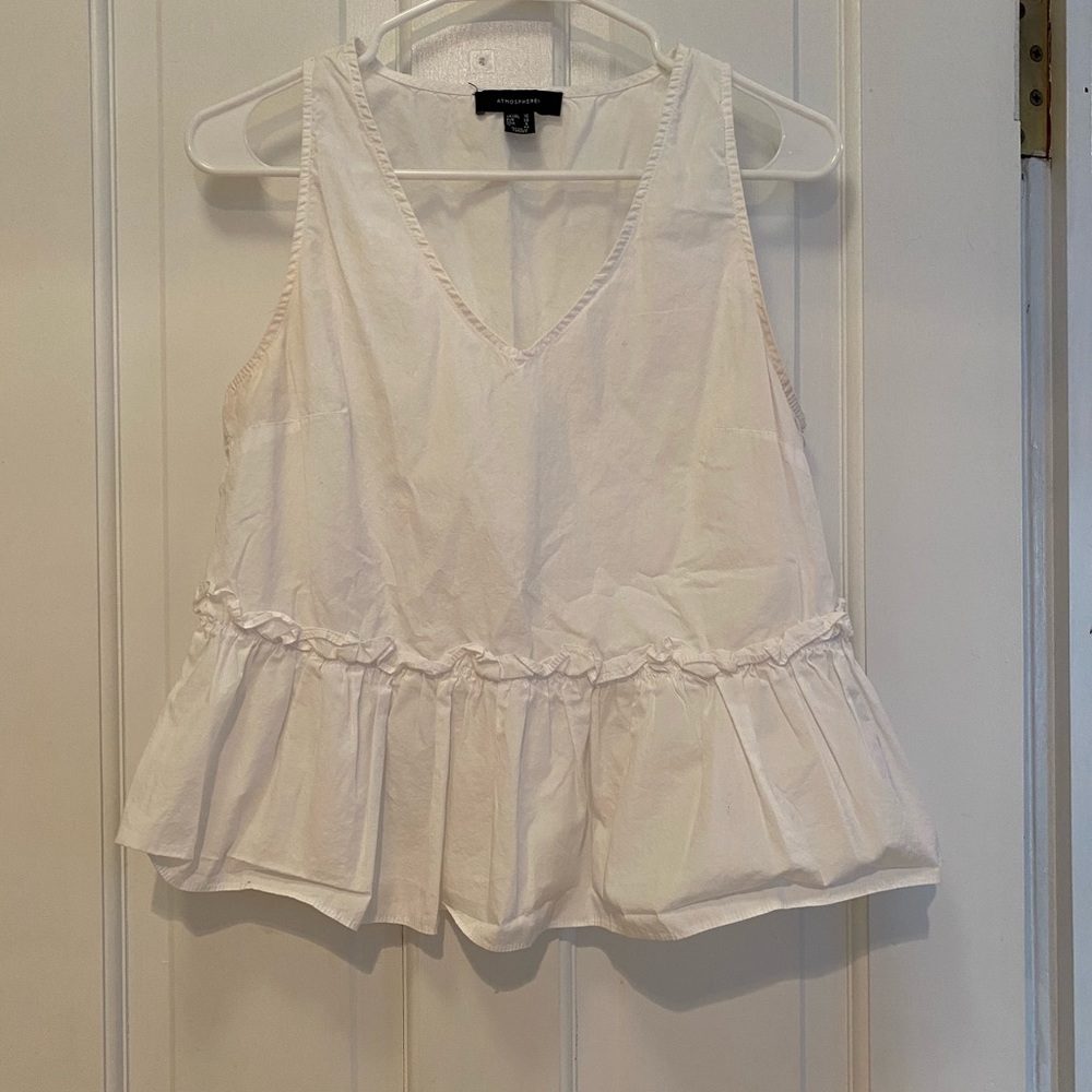 Cute peplum white v-neck sleeveless top!